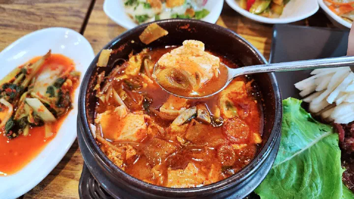 Bulgogi served over freshly cooked stone-pot rice