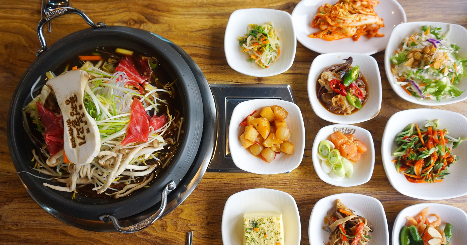 Bulgogi hot pot with stone-pot rice and side dishes at Pungjeong Bulgogi in Boryeong