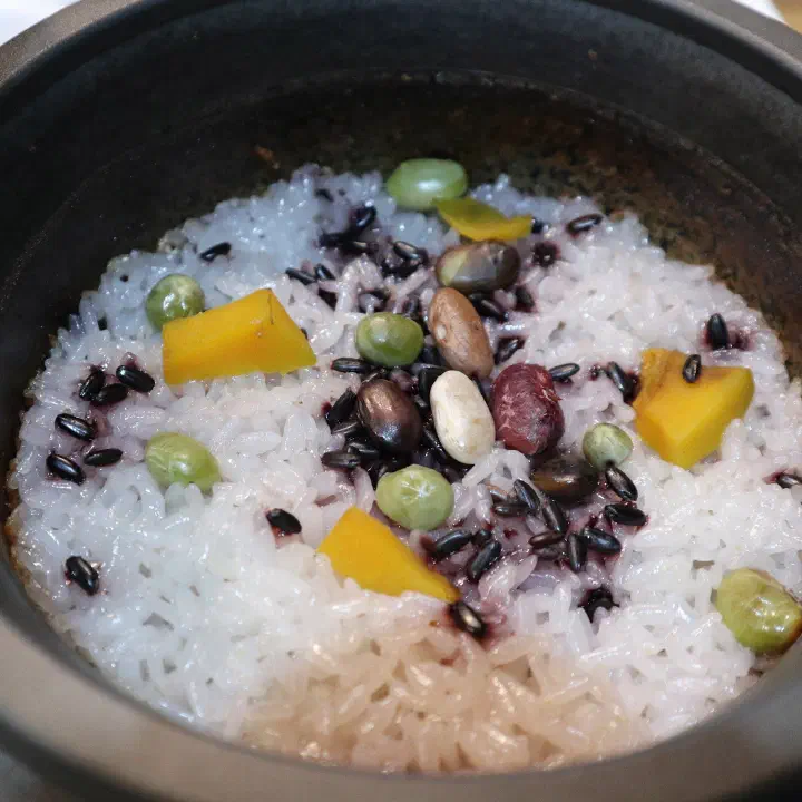 Multigrain stone-pot rice with black beans, peas and sweet pumpkin