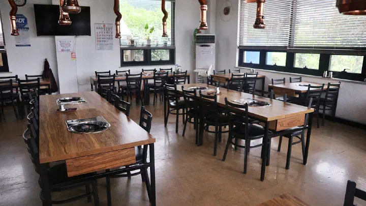 Interior of Pungjeong Bulgogi, bright and spacious with large windows