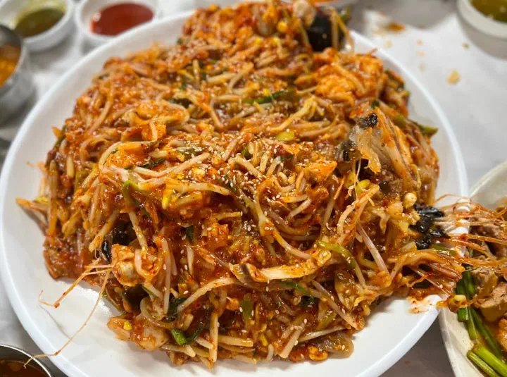 Close-up of spicy braised monkfish with sancho and bangah, fresh monkfish and bean sprouts in red sauce