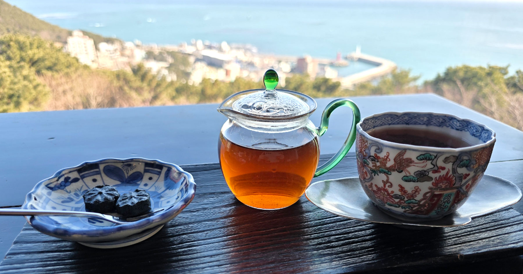 Tea table by the window at Bibibidang overlooking Cheongsapo sea