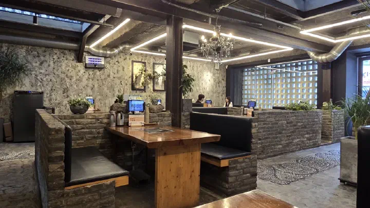 Interior of Handasot, charcoal oven and wood furnishings