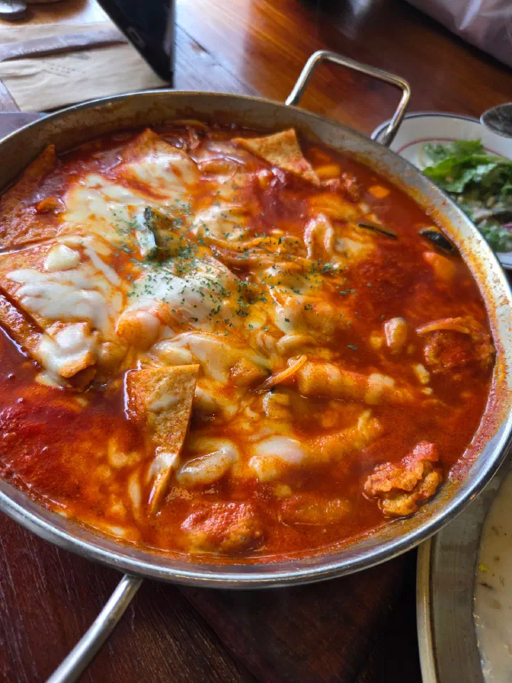 Cheongchun Chitteok, cheese-topped tteokbokki with shrimp and kabocha squash at Cheongchun Kitchen