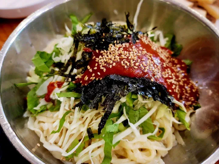 Springy cold-rinsed hand-cut noodles used for bibimguksu at Kimhwa Kalguksu