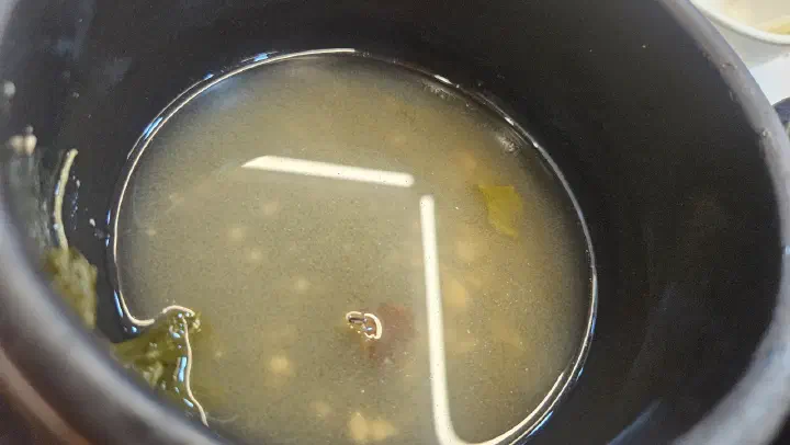 Individual earthen pot of doenjang soup at Hansangeun Daetongbapjip