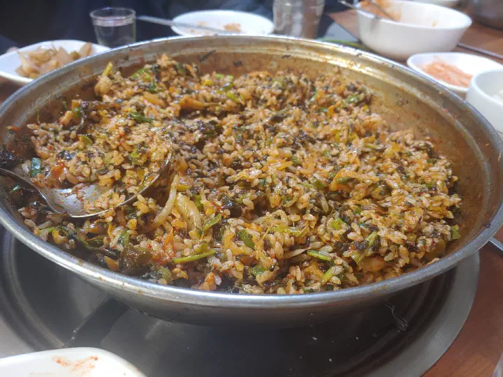 Fried rice cooked in the leftover monkfish sauce with minari and seaweed at Samdado