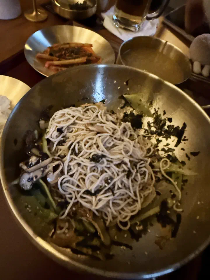 Buckwheat noodles tossed with perilla oil, crushed perilla seed and seaweed flakes for the first eating step