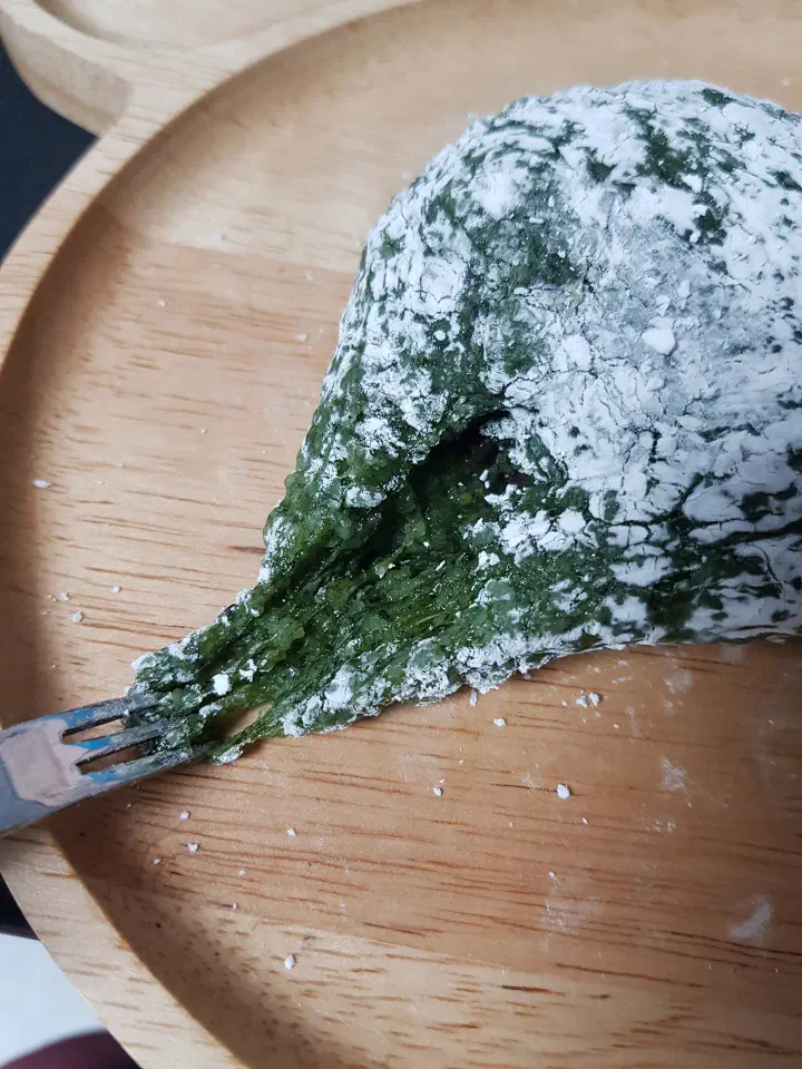 Chamsoon Chaltteokbang mugwort mochi stretching chewily as it’s pulled with a fork