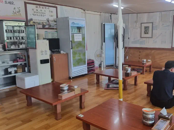 Interior of Geumcheon Kalguksu with low tables and traditional Korean floor seating