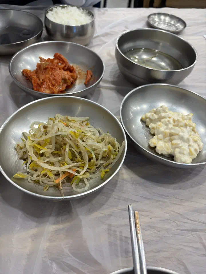 Close-up of kimchi, bean sprout soup, seasoned bean sprouts and creamy corn salad