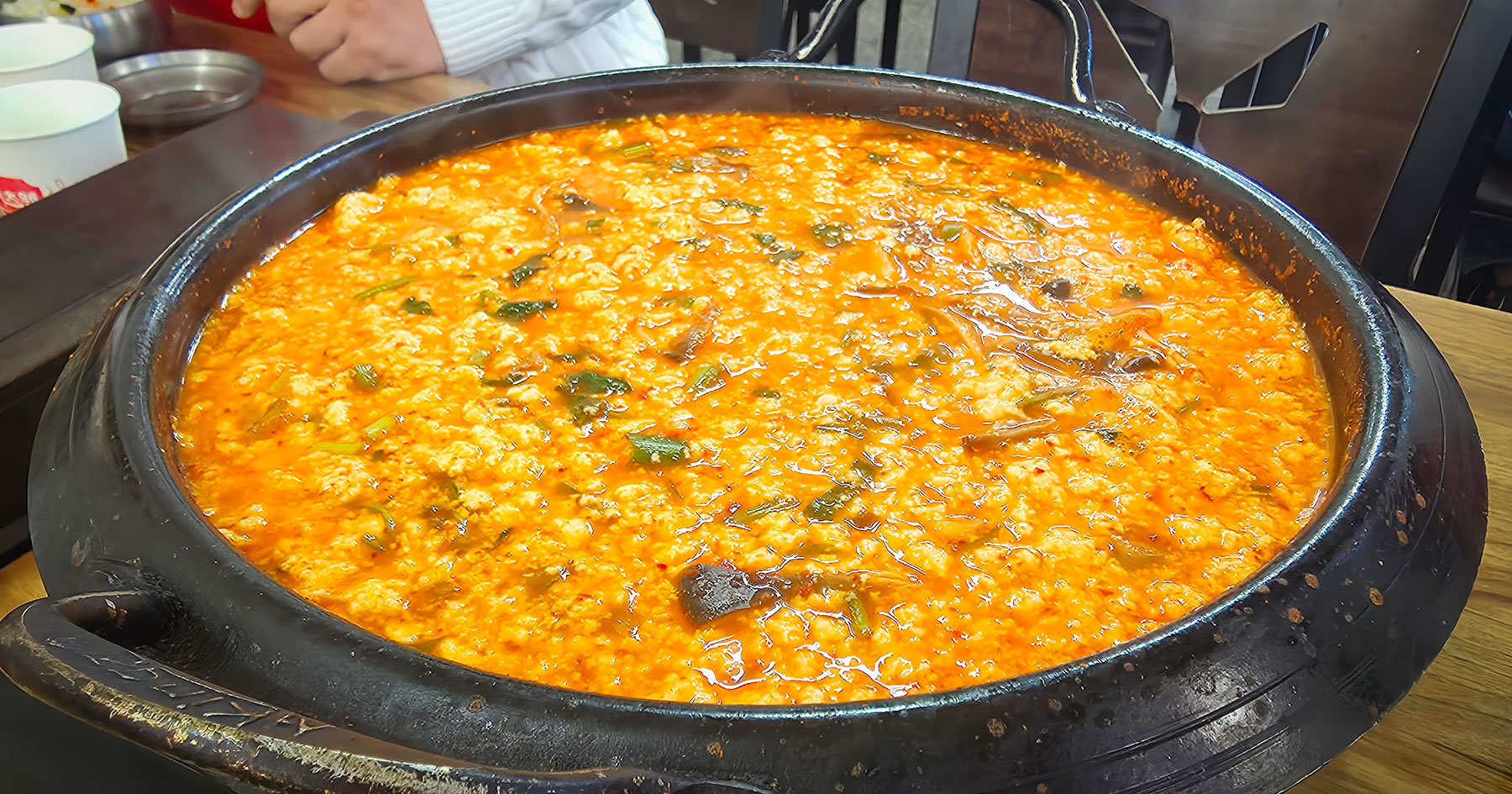 Sundubu jeongol tofu hot pot with side dishes at Gunammae Dubujip