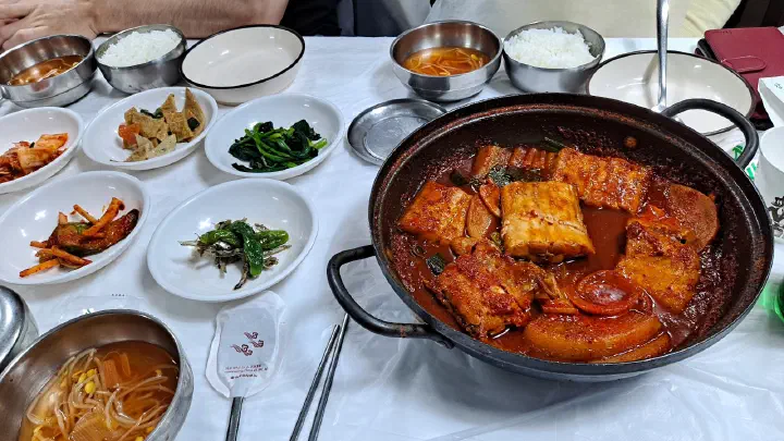 Two-person galchi jorim set at Jeonghwa Sikdang with side dishes, bean sprout soup and rice