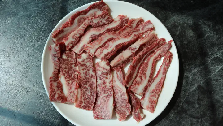 Raw hanwoo sirloin with fine marbling at Cheolma Hanwoo Chowon