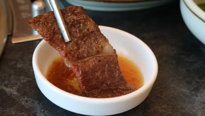 Hanwoo dipped in salt and sesame oil at Cheolma Hanwoo Chowon