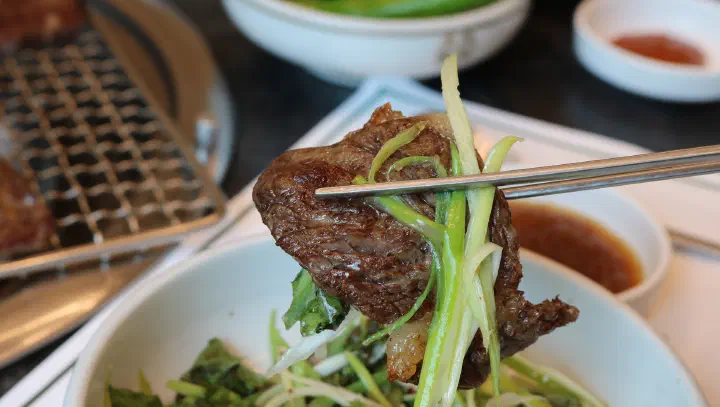 Lettuce wraps and side dishes at Cheolma Hanwoo Chowon