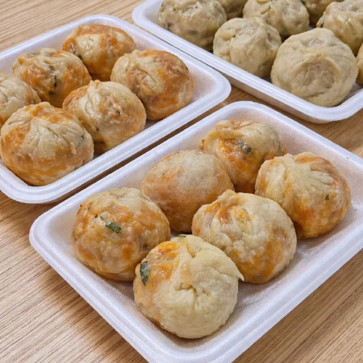 A spread of freshly steamed dumplings and buns bought at Ilgwangdang