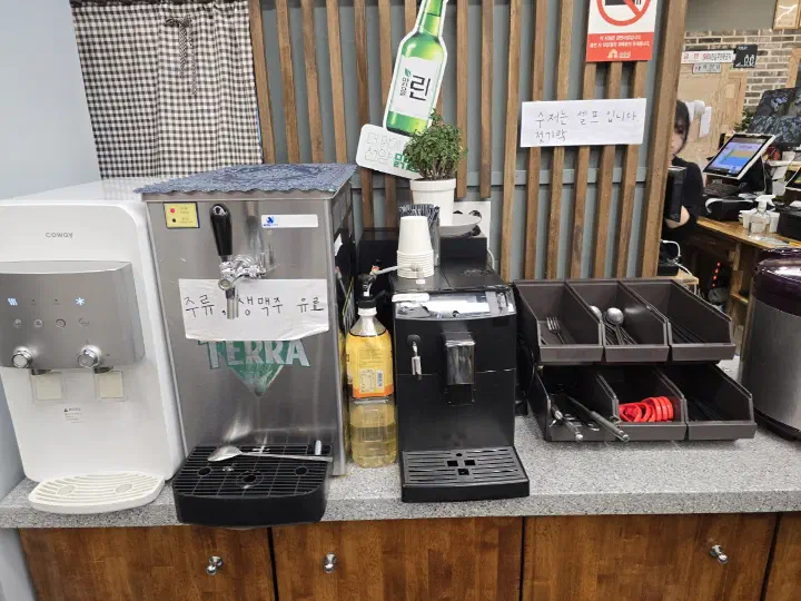 Self-serve corner with drinks and pickles