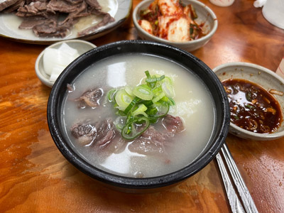 A full table setting at Choimija Someori Gukbap