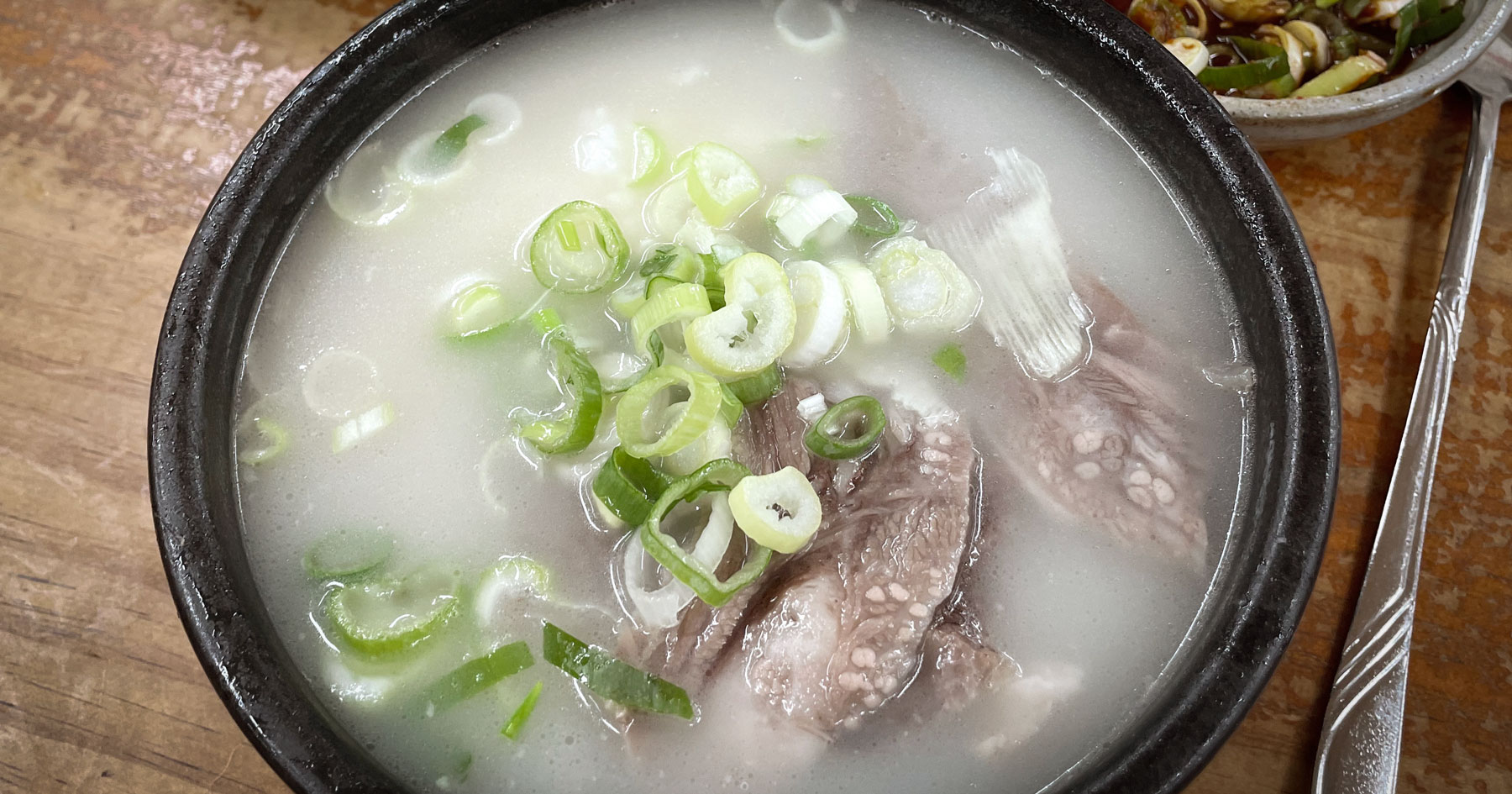 A bowl of milky ox-head soup at Choimija Someori Gukbap in Gonjiam