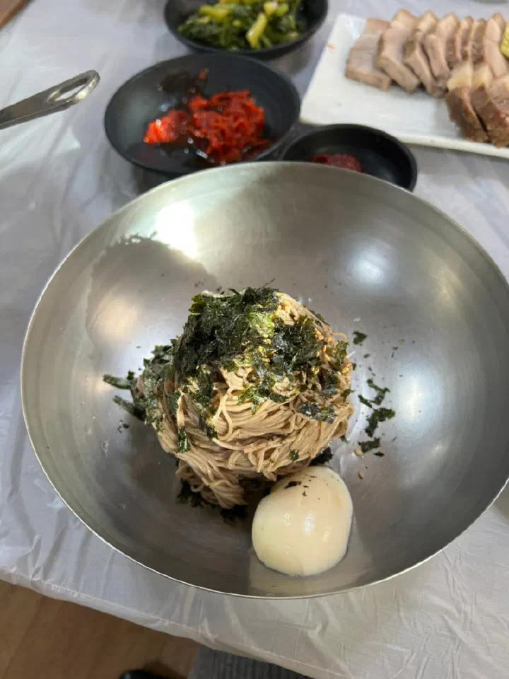 Baekchon Makguksu bibim makguksu, buckwheat noodles mixed with seasoning and laver