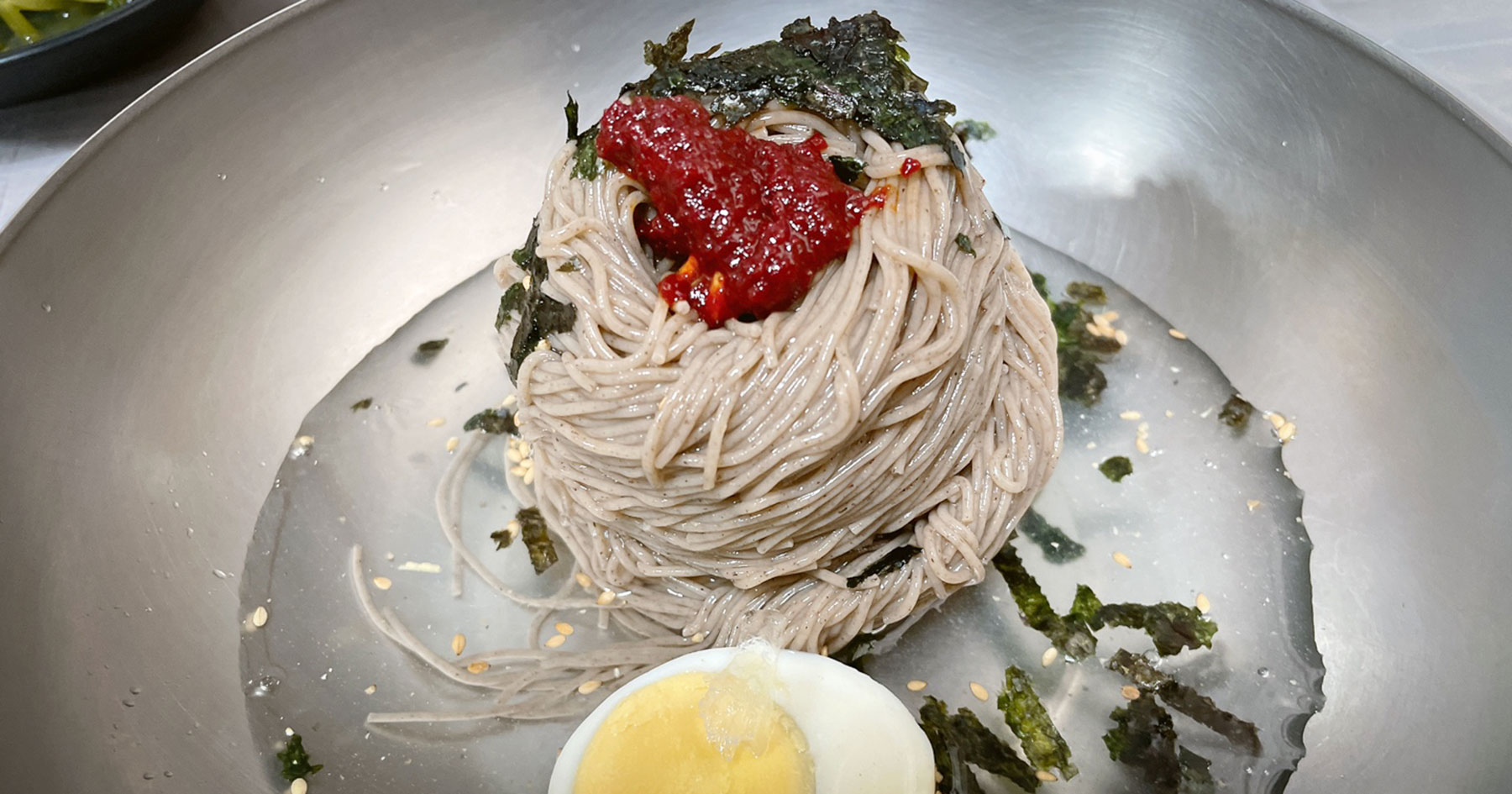 Buckwheat noodles and sliced pork at Baekchon Makguksu