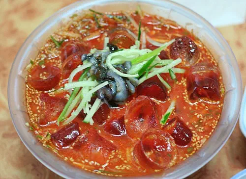 Top view of gajami sekkosi mulhoe, spicy cold raw flatfish soup, at Gwangbeomine Hoetjip