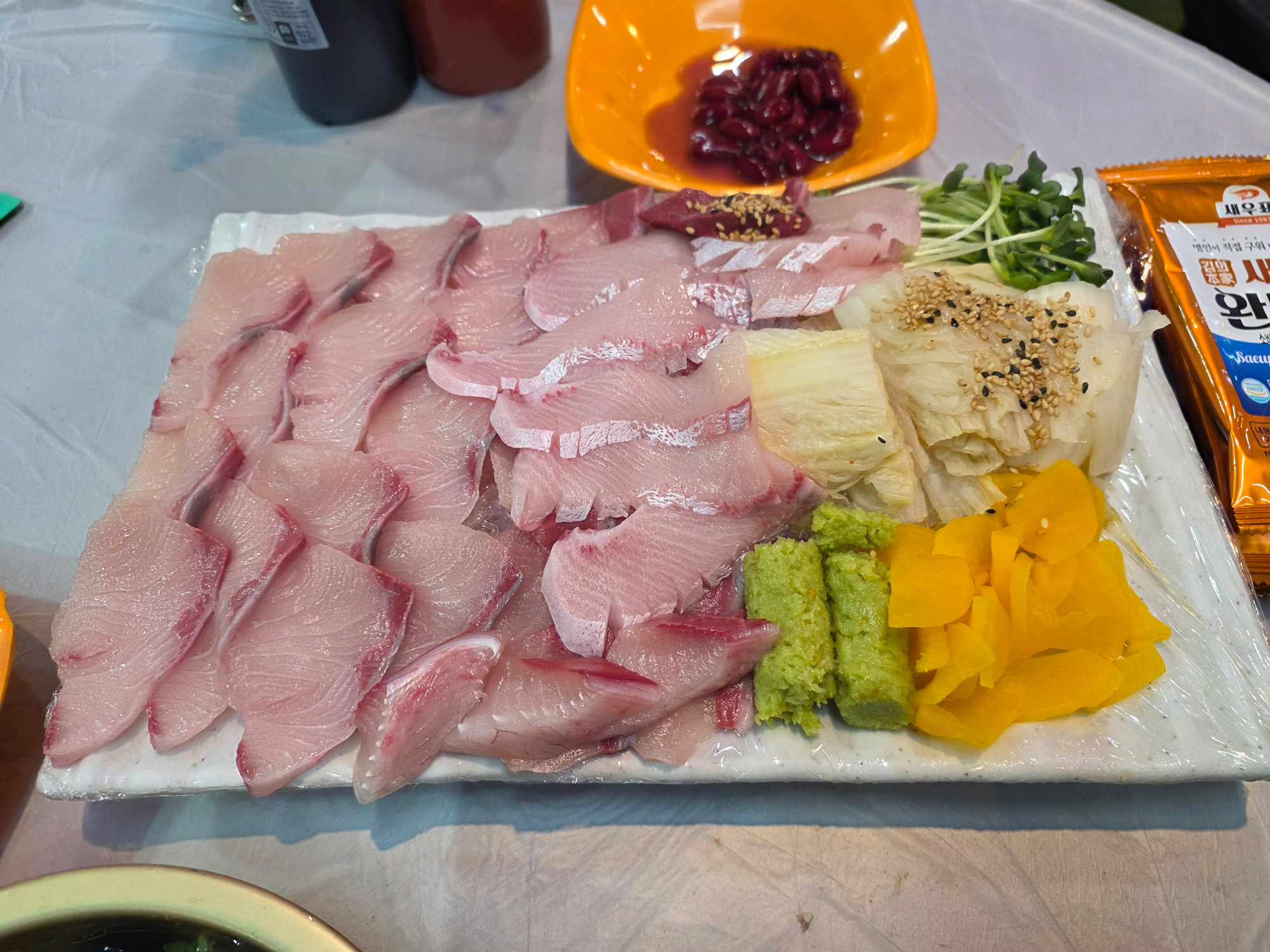 Giant amberjack sashimi, thick glossy slices
