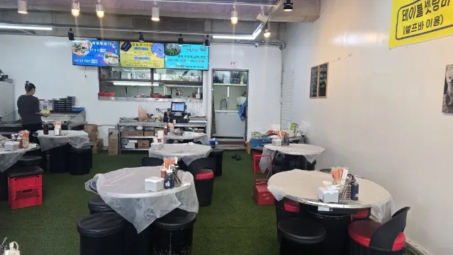 Inside Haejeoksusan with simple tables and a market-style layout