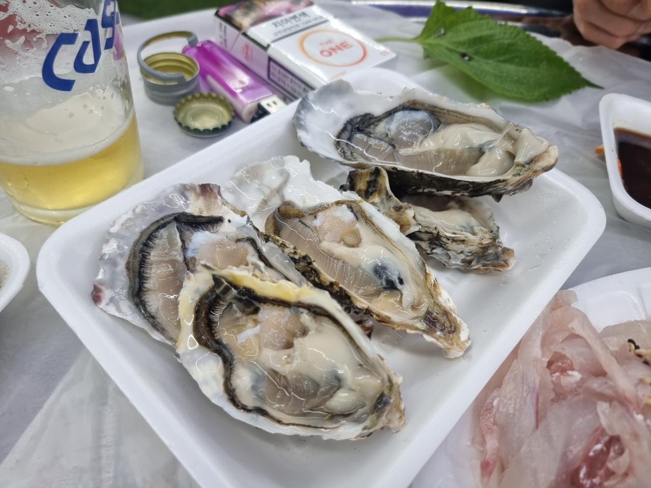 Sea pineapple and oysters served on a plate