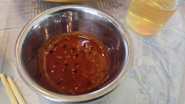Spicy house dipping sauce served with the sashimi