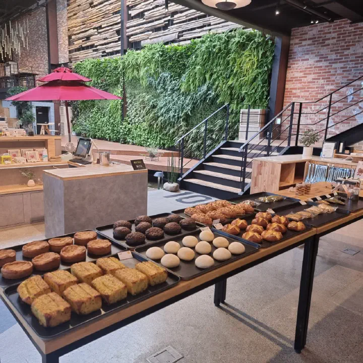 Freshly baked garlic bread, salt bread, and chestnut bakes on display at The Road 101