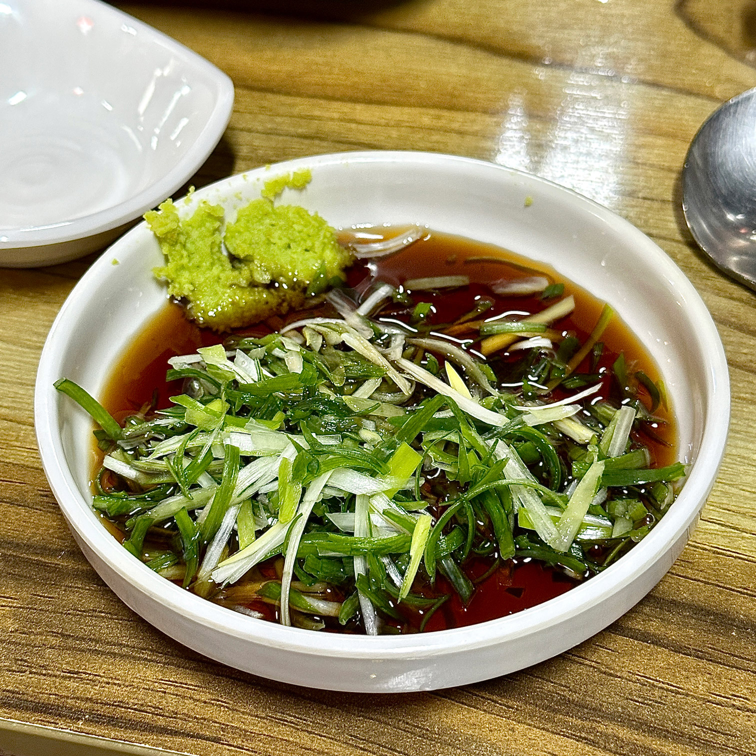 Signature scallion soy sauce with wasabi at Dapeojuneunjip