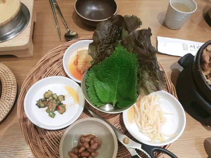 Ssam lettuce and stone-pot rice spread at Saerijae