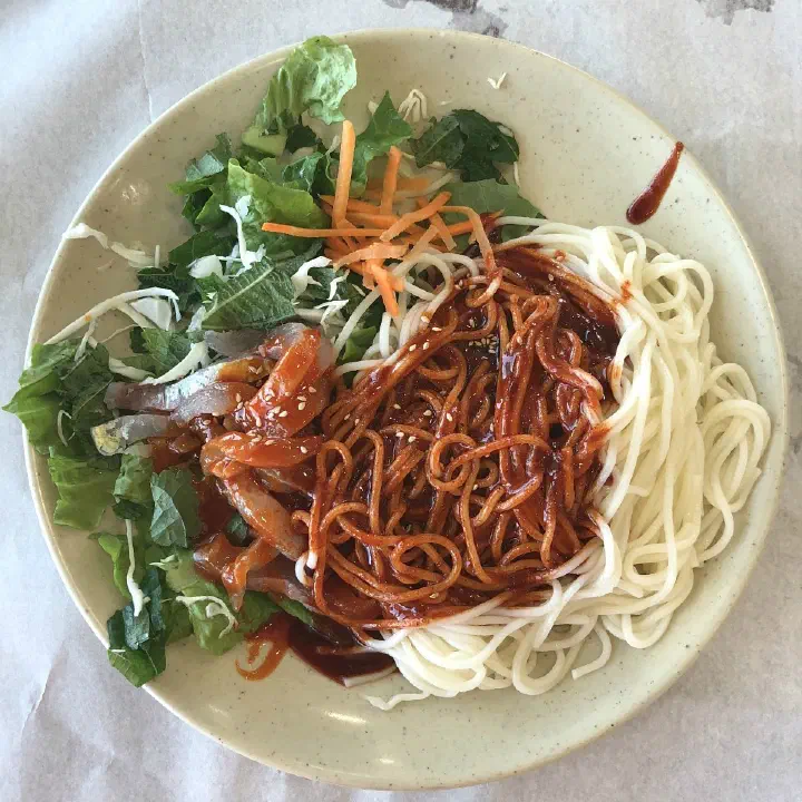 Chonchon Haenyeochon hoe-guksu with raw fish and spicy sauce over thick wheat noodles
