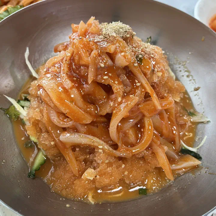 Chonchon Haenyeochon mixed mulhoe piled high with assorted fresh seafood