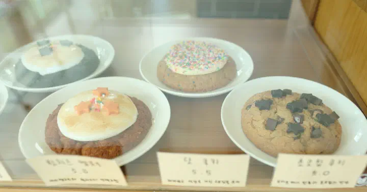 Thick chocolate chip and other signature cookies on display at Cookiemeow
