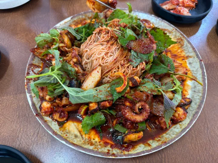Stir-fried rock octopus and somyeon noodles fully mixed into the sweet and spicy sauce