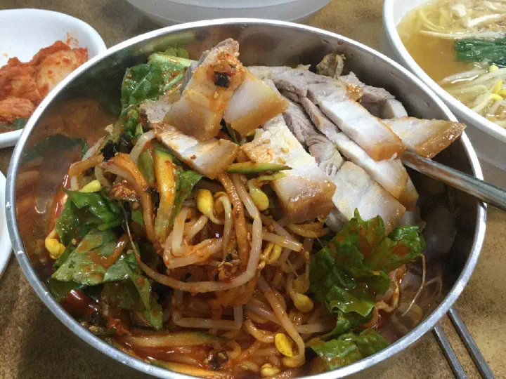 Jamae Guksu bibim-guksu, spicy sweet-and-tangy mixed noodles with bean sprouts, cucumber, lettuce and pork