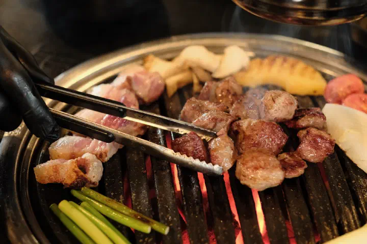 Close-up of grilled Jeju black pork neck, browned and ready to eat