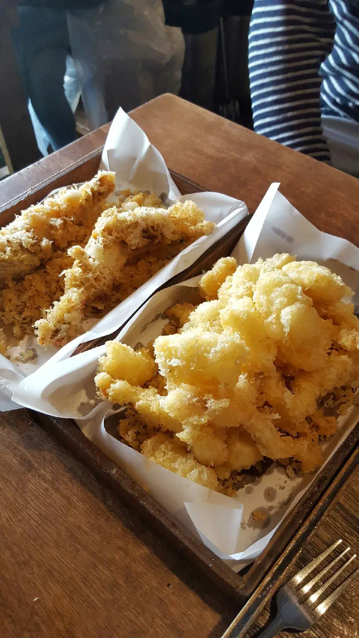 Two baskets of Pyeongdae Snack hanchi squid tempura and king prawn tempura