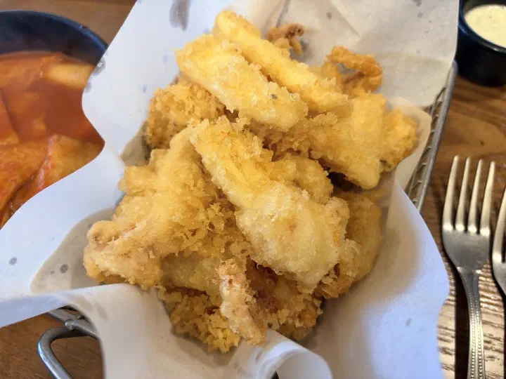 Pyeongdae Snack signature hanchi-twigim - a basket of crisp Jeju squid tempura