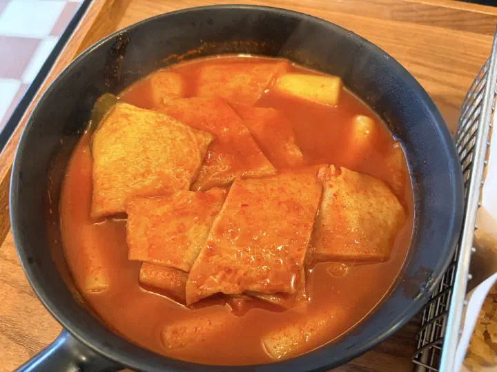 Close-up of Pyeongdae Snack soupy tteokbokki seasoned with chili powder