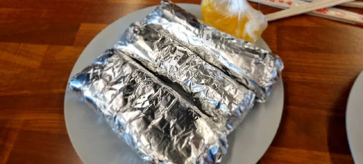 Oneunjeong gimbap rolls wrapped in aluminum foil for takeout