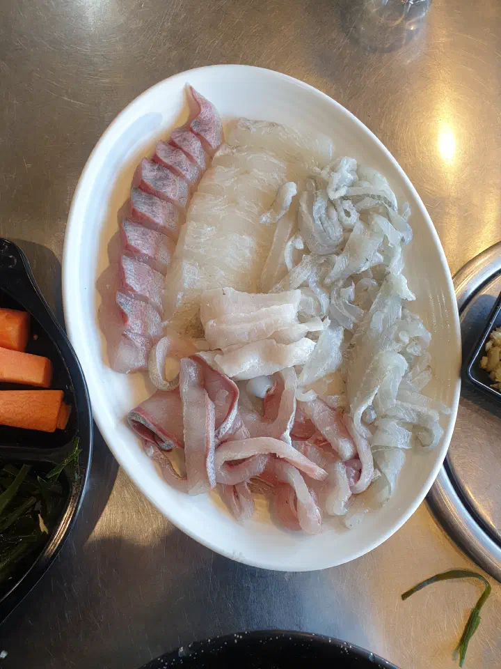 A platter of thinly sliced white-fish sashimi at Dongbu Hoe Center