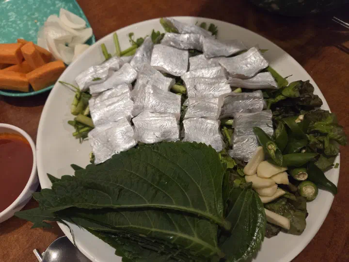 Galchi-hoe, silvery cutlassfish sashimi served with perilla leaves, garlic and green chili
