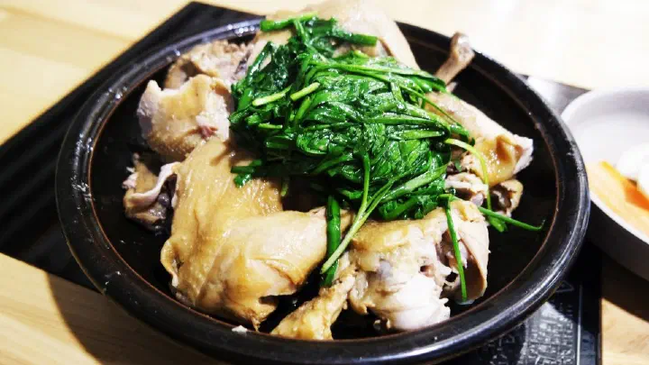 A full plate of the chive-topped steamed chicken