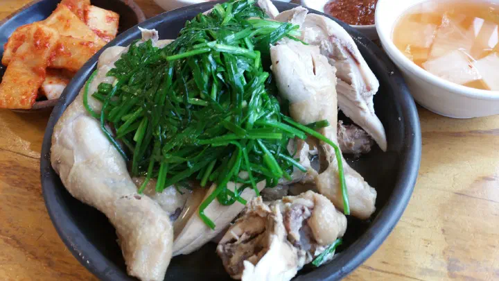 The clear broth served under the steamed chicken
