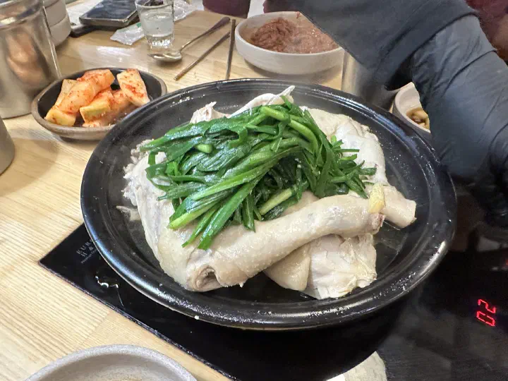 A close look at the chive-topped steamed chicken