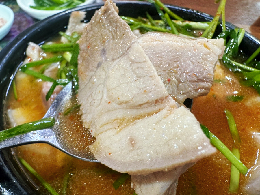 Tender, thick-cut pork pieces in the broth